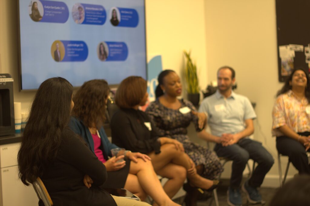 Group of alumni seated speaking at a panel.