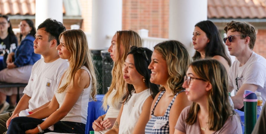 Students smiling and laughing while seated