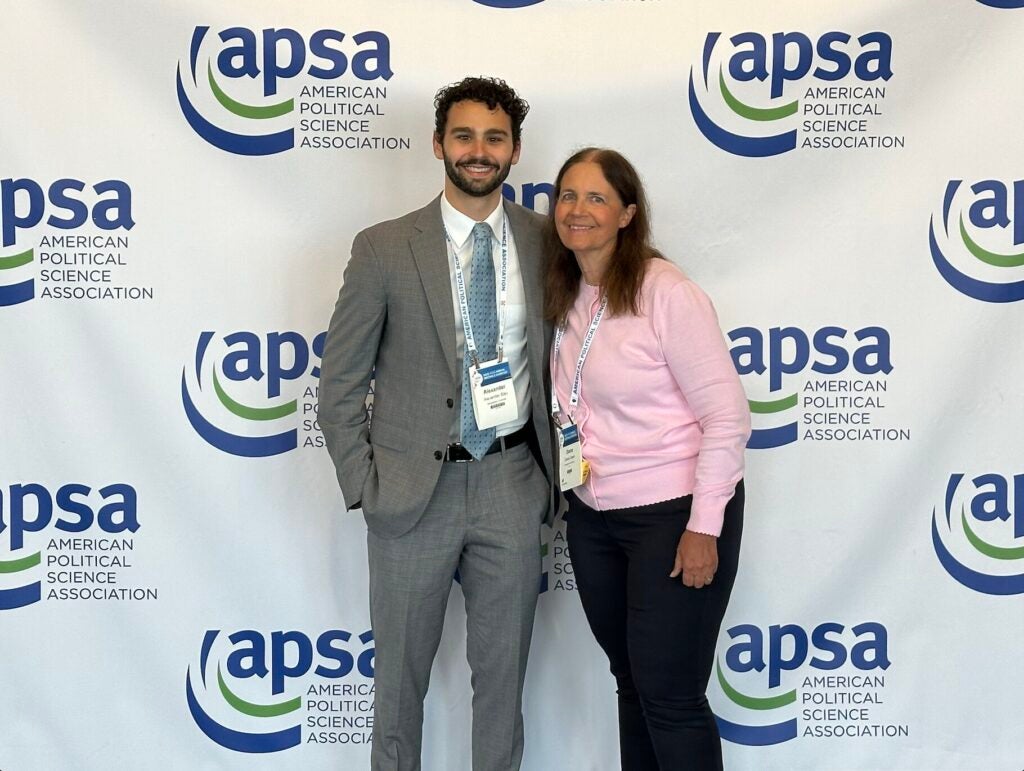 Student Alex Blau stands with Professor Dr. Diana Owen at the American Political Science Association